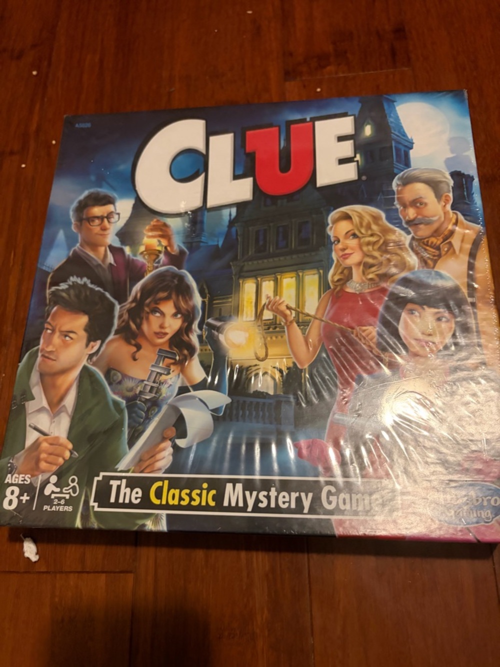 Hasbro CLUE Board Game – Blue, Red, Yellow Artwork